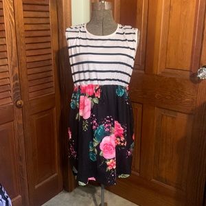 Cute flower dress, longer in back very good quality never worn